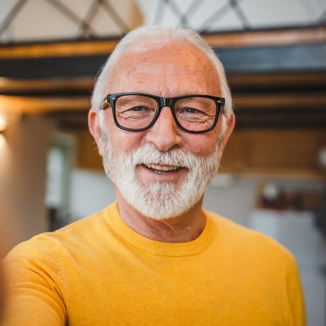 One modern senior caucasian man with glasses