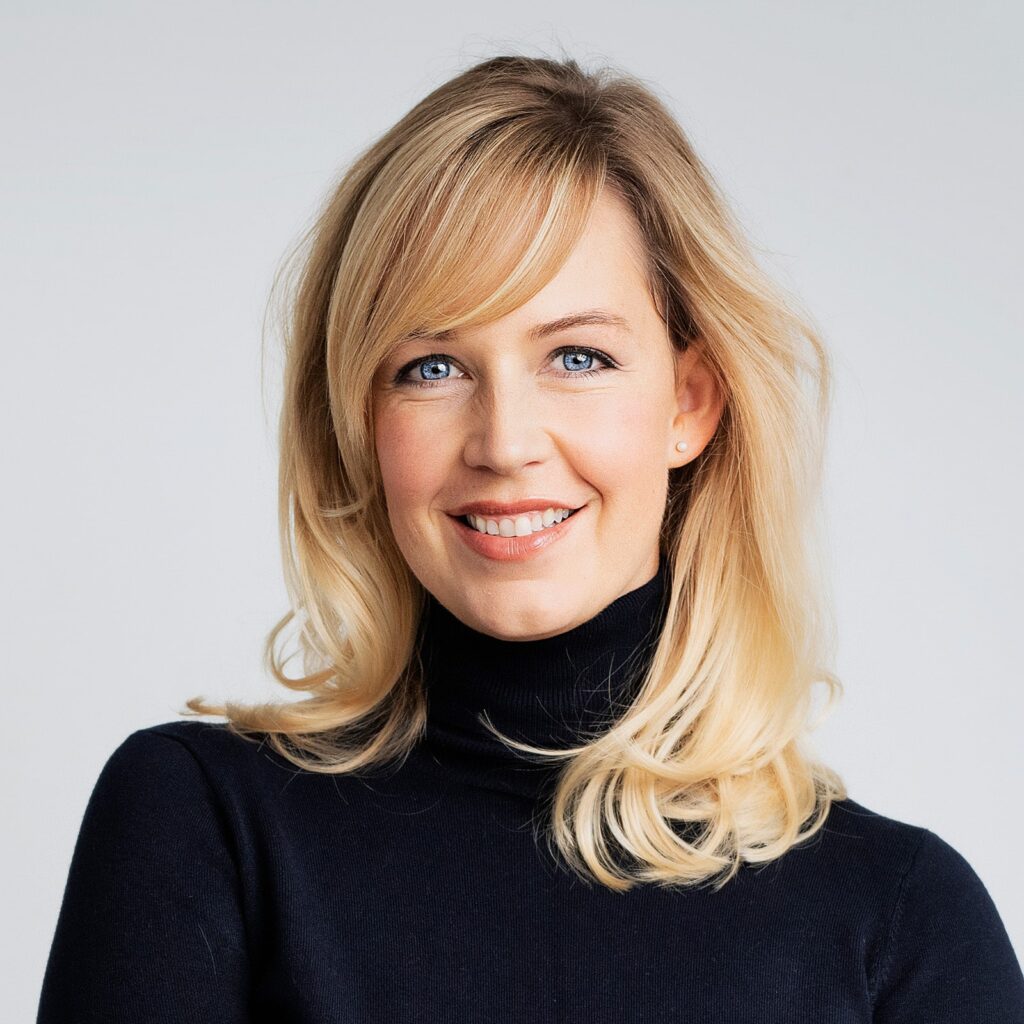 attractive woman smiling and looking at camera